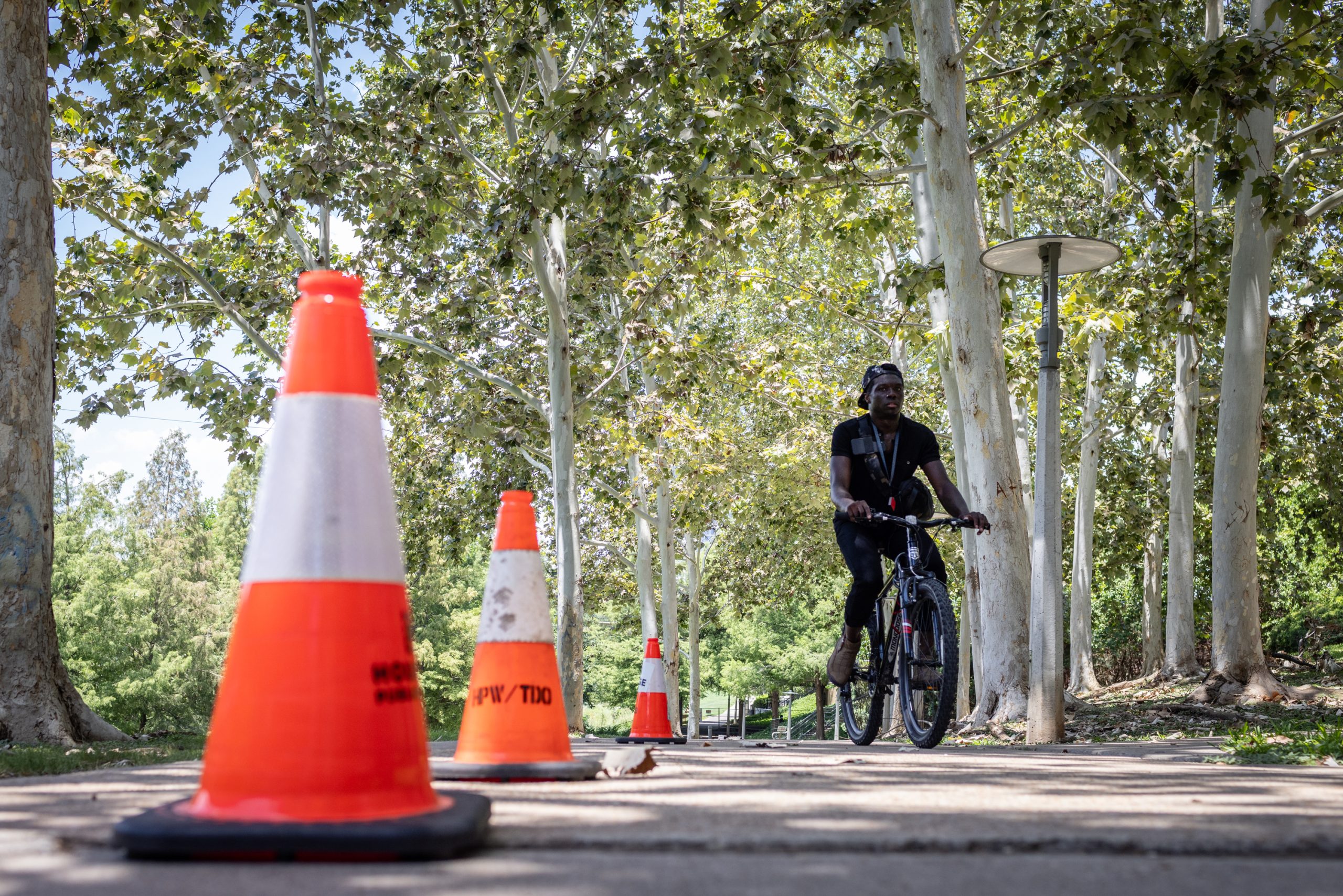 A bicyclist turns around at a closed section of Buffalo Bayou Park trail in Houston