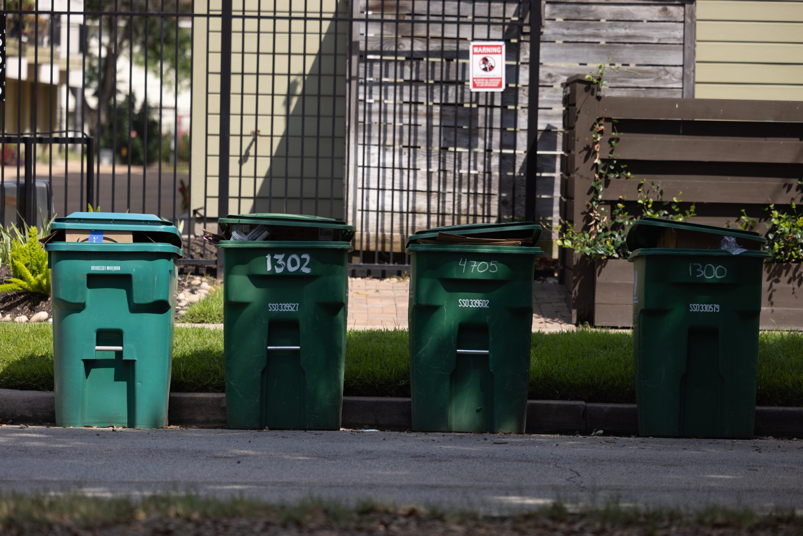 Uncollected city of Houston recycling bins