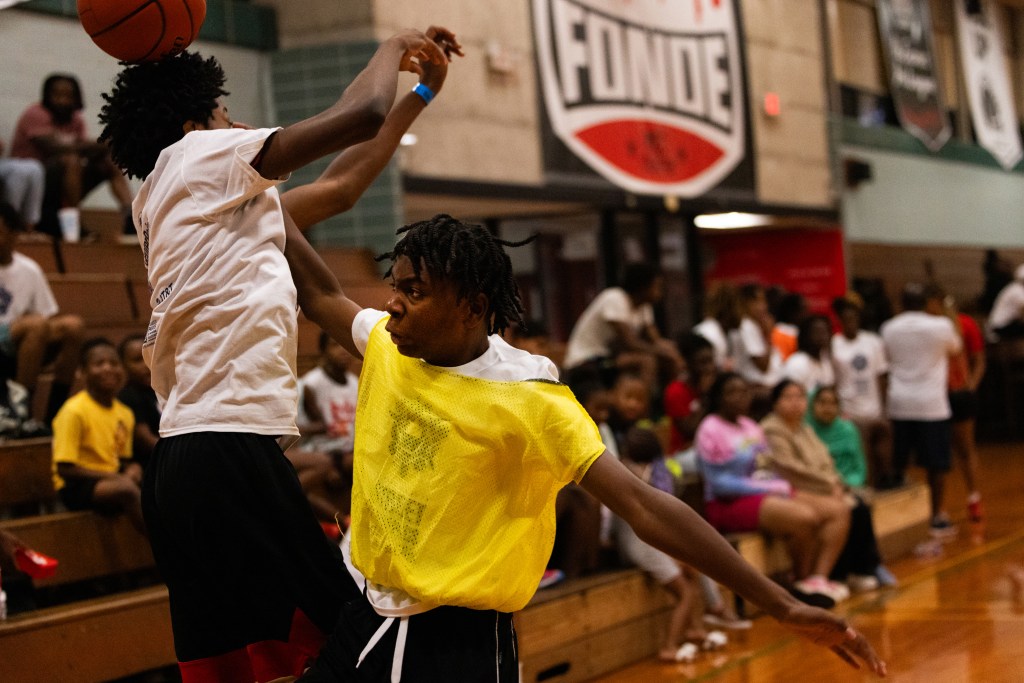 Two young basketball players at a tournament