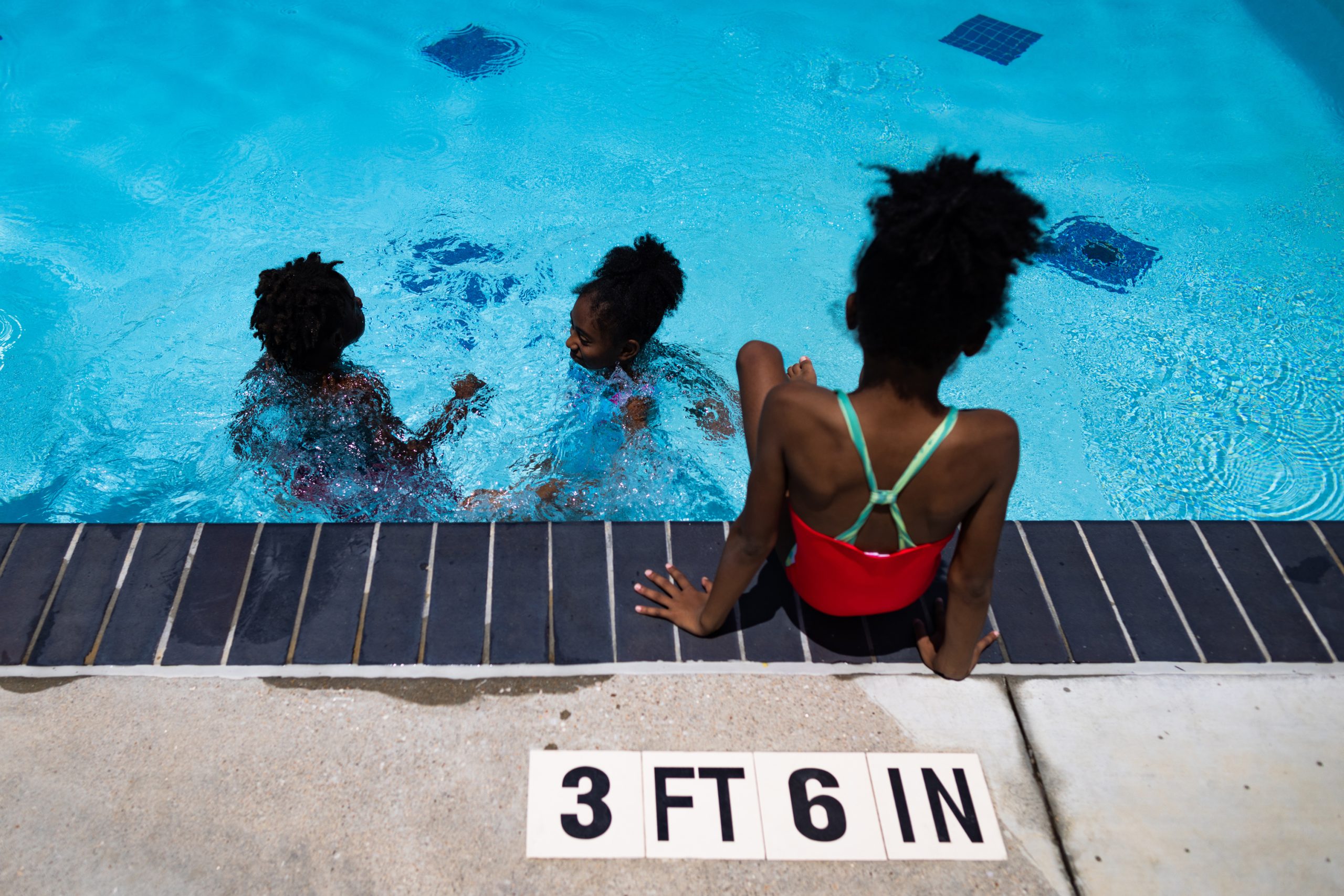 Children from the Platou Community Center Summer Enrichment Program enjoy the Alief Neighborhood Center and Park pool facility.