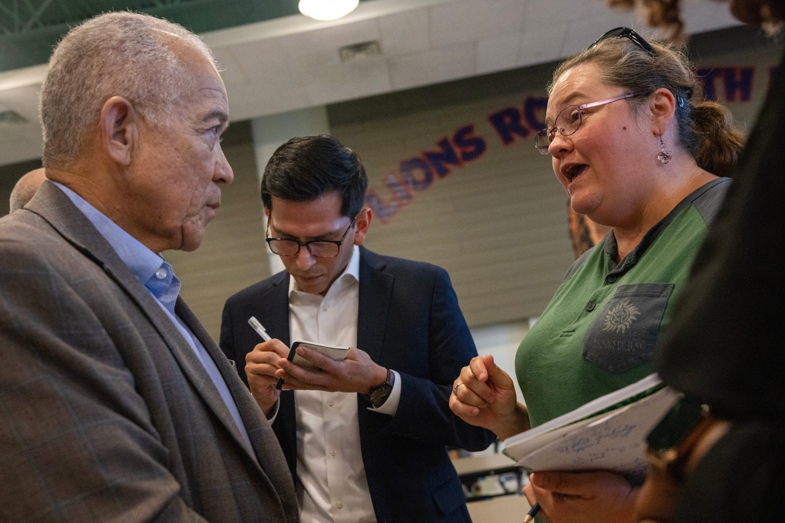 Houston ISD Superintendent Mike Miles speaks with Dana Castro after a community engagement event July 27 at Sugar Grove Academy on the district's west side