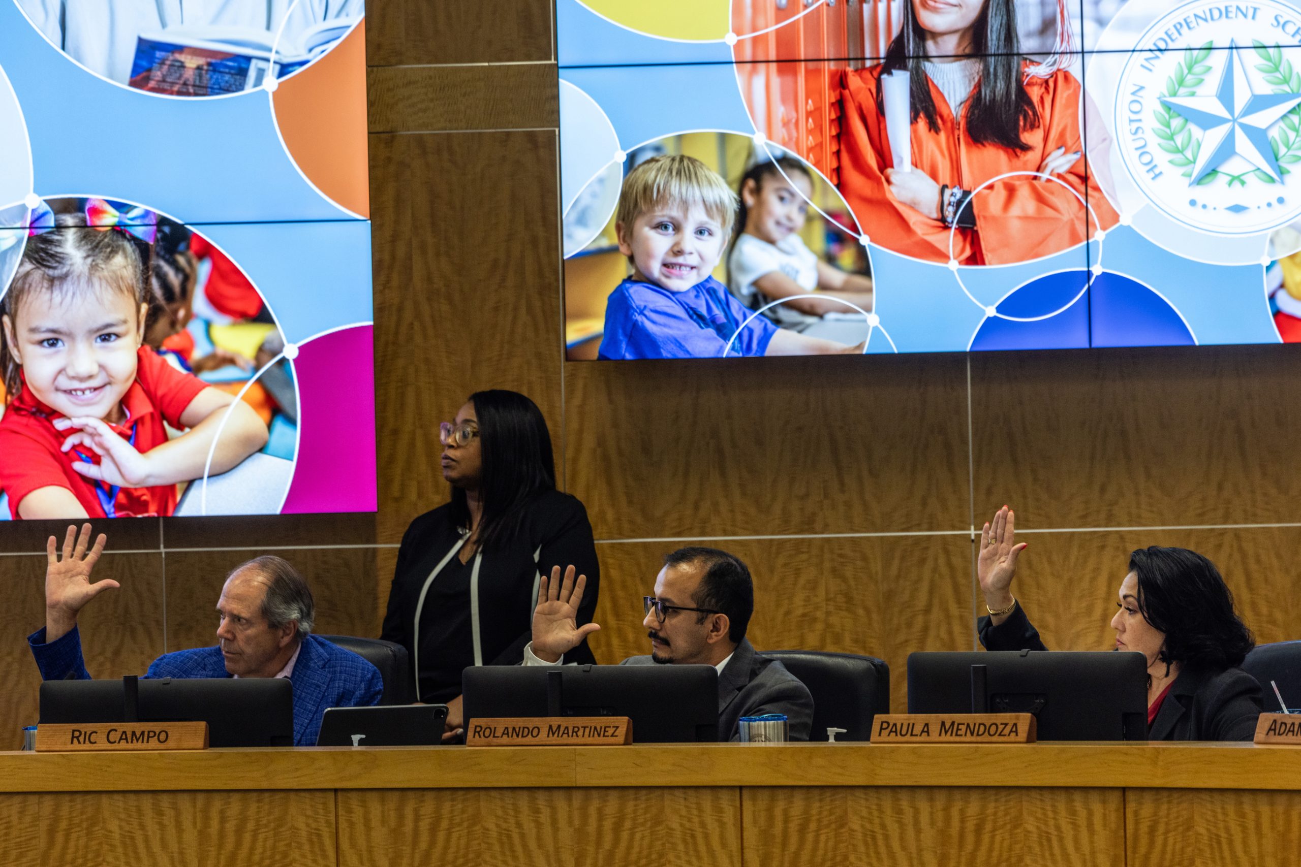 Houston ISD board members cast a vote during a meeting Aug. 10 at the district's northwest Houston headquarters