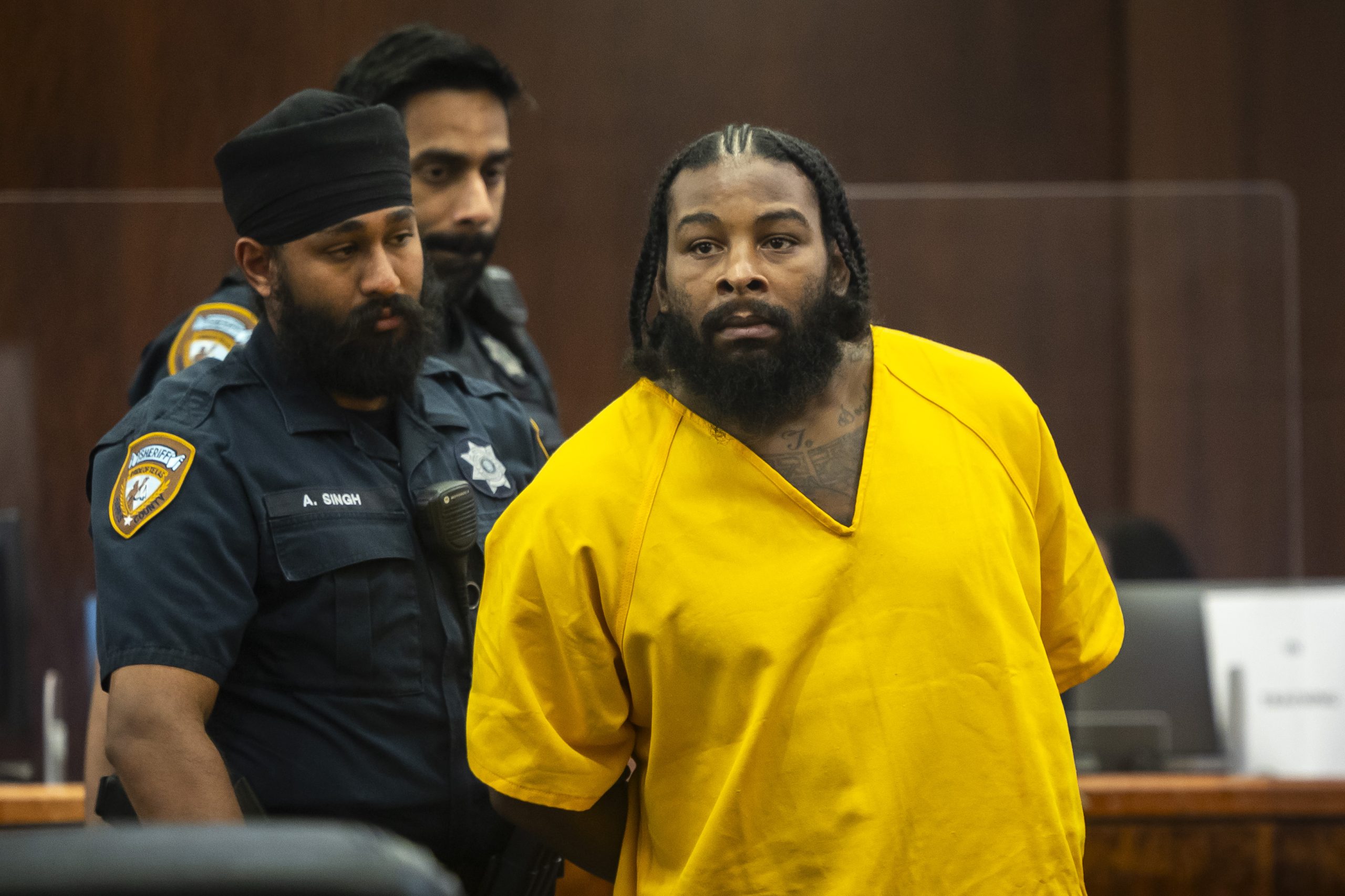 Terran Green, who faces four charges of attempted murder of a peace officer, appears in court Monday at the Harris County Criminal Justice Center in downtown Houston.