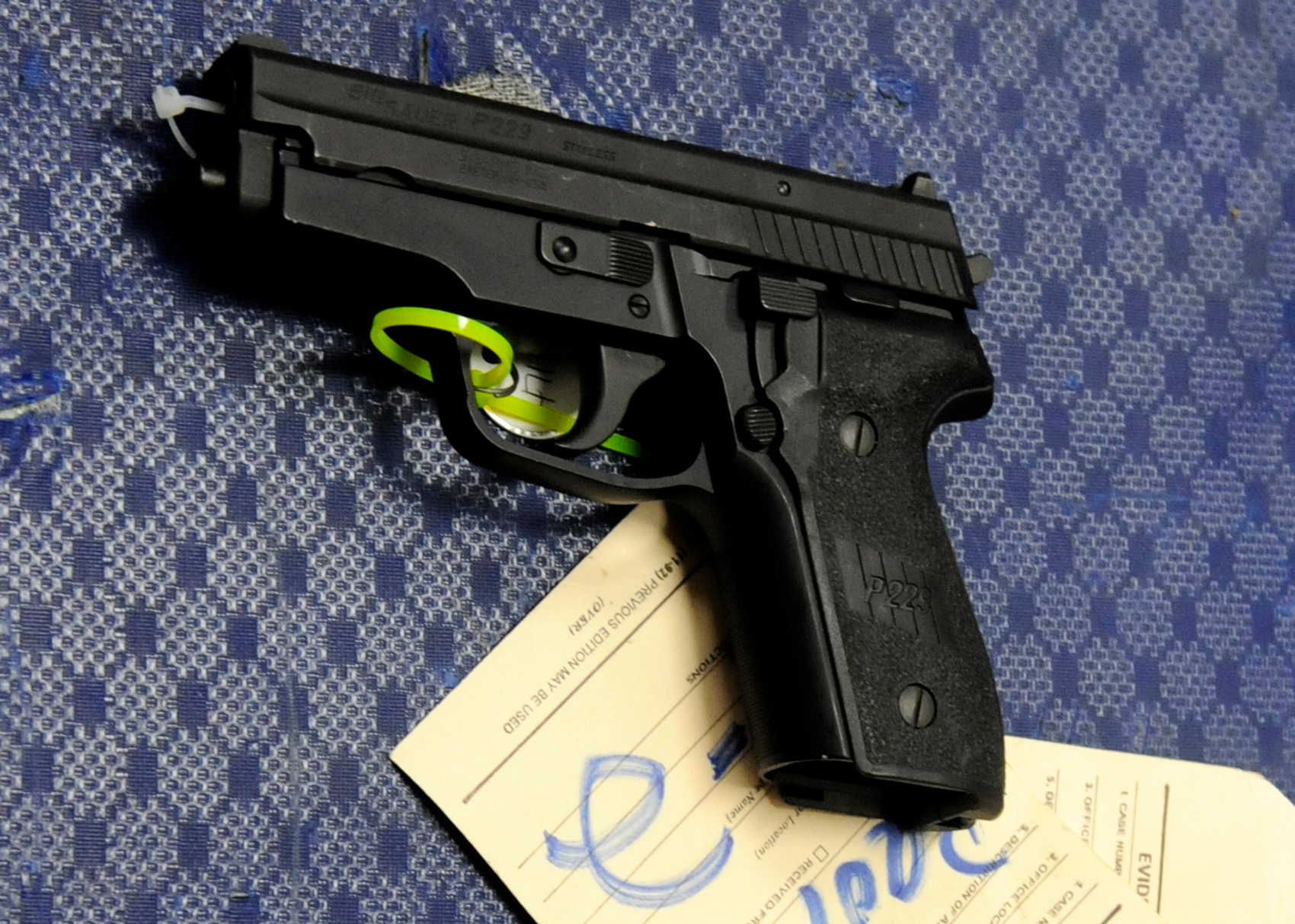A Sig Sauer 9mm pistol, a popular gun used by Mexican drug cartels, is displayed at a Bureau of Alcohol, Tobacco, Firearms and Explosives' news conference Tuesday, April 28, 2009 in Houston.