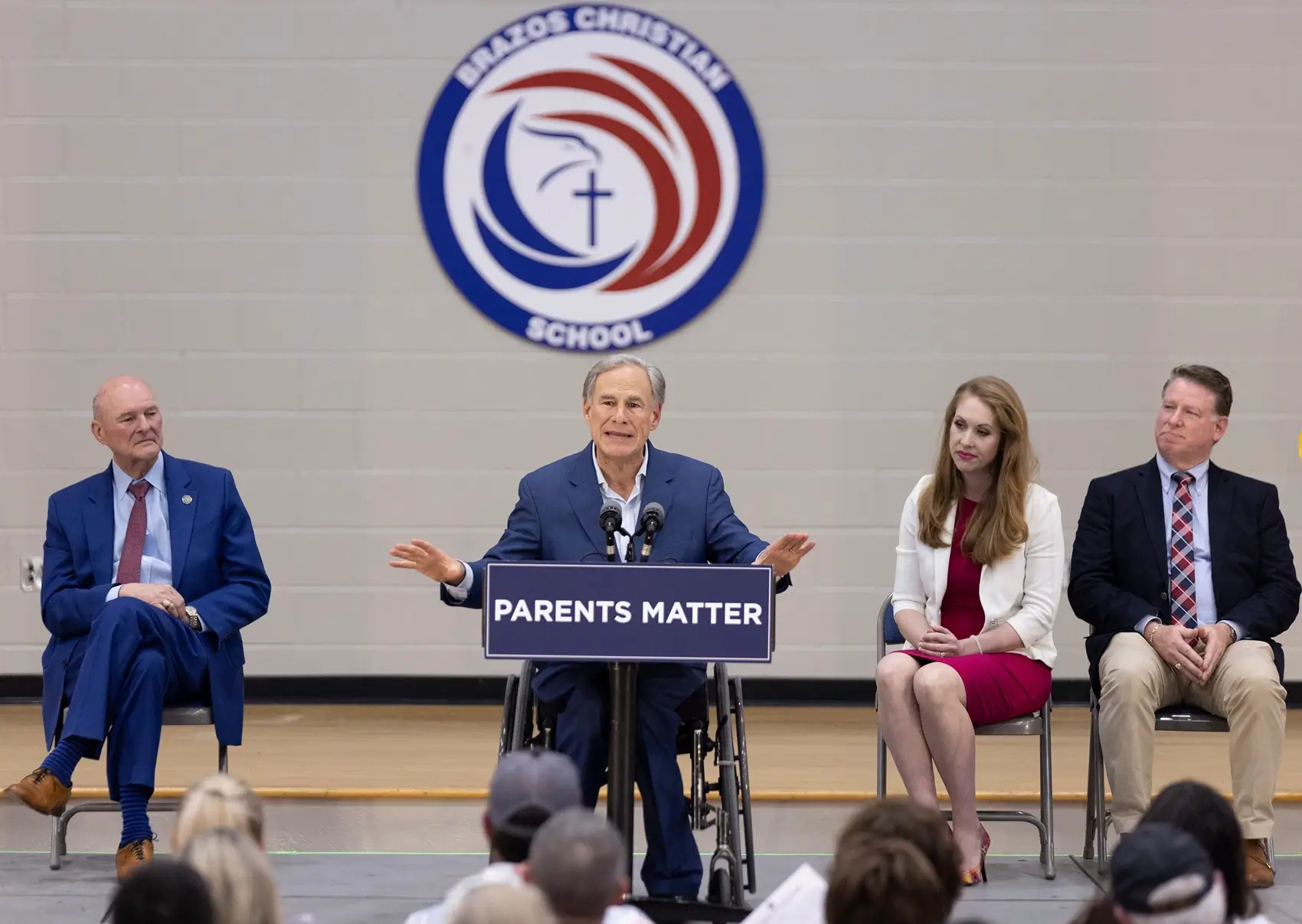 Texas Gov. Greg Abbott, center, speaks at Brazos Christian School in Bryan, Texas, on Tuesday, March 7, 2023. Abbott visited the school as a part of the Parent Empowerment Coalition's tour.