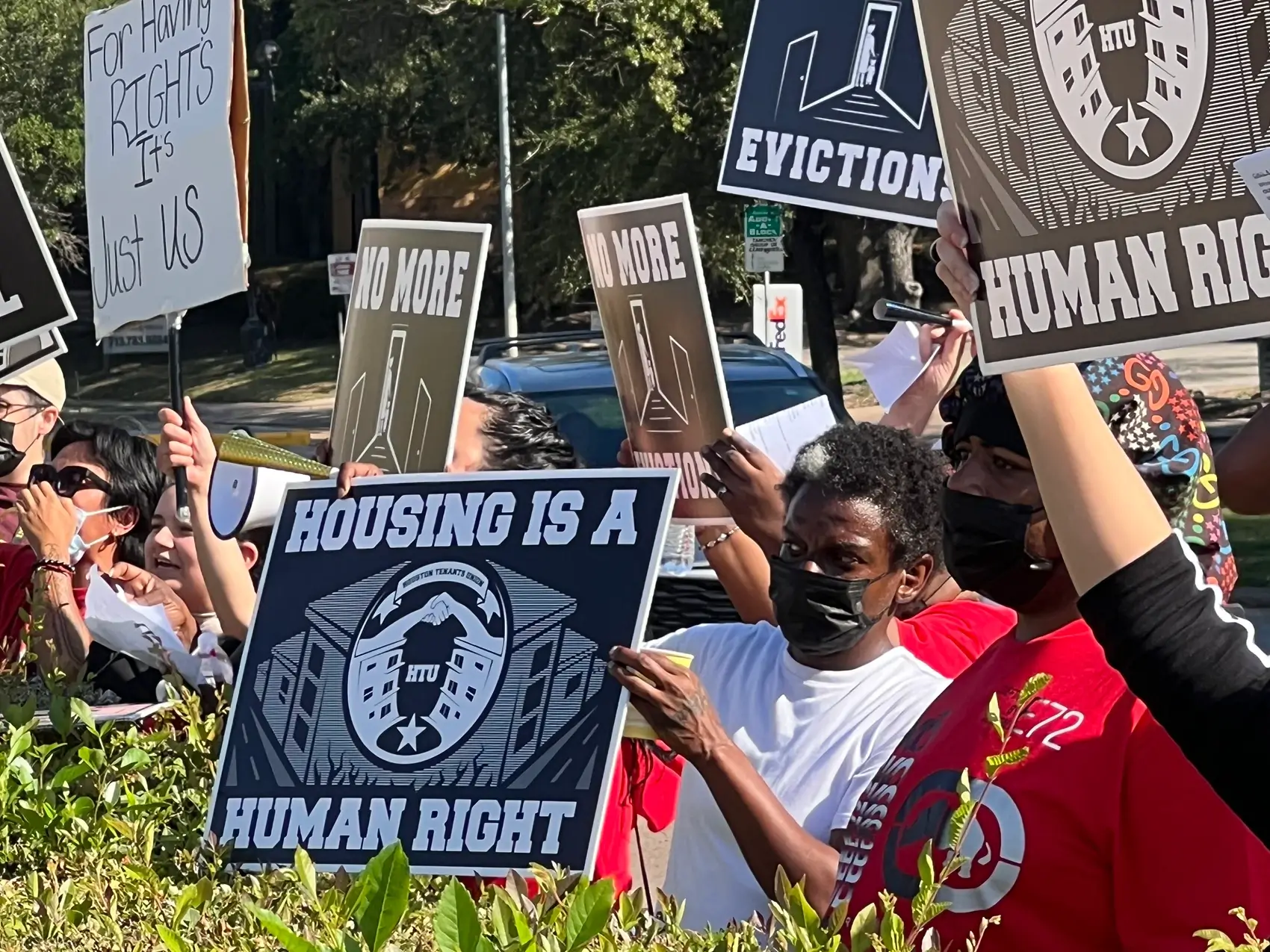 Residents of the Cabo San Lucas and The Redford apartment complexes protest the Houston Housing Authority's response to living conditions Monday at the agency's Greater Uptown headquarters.