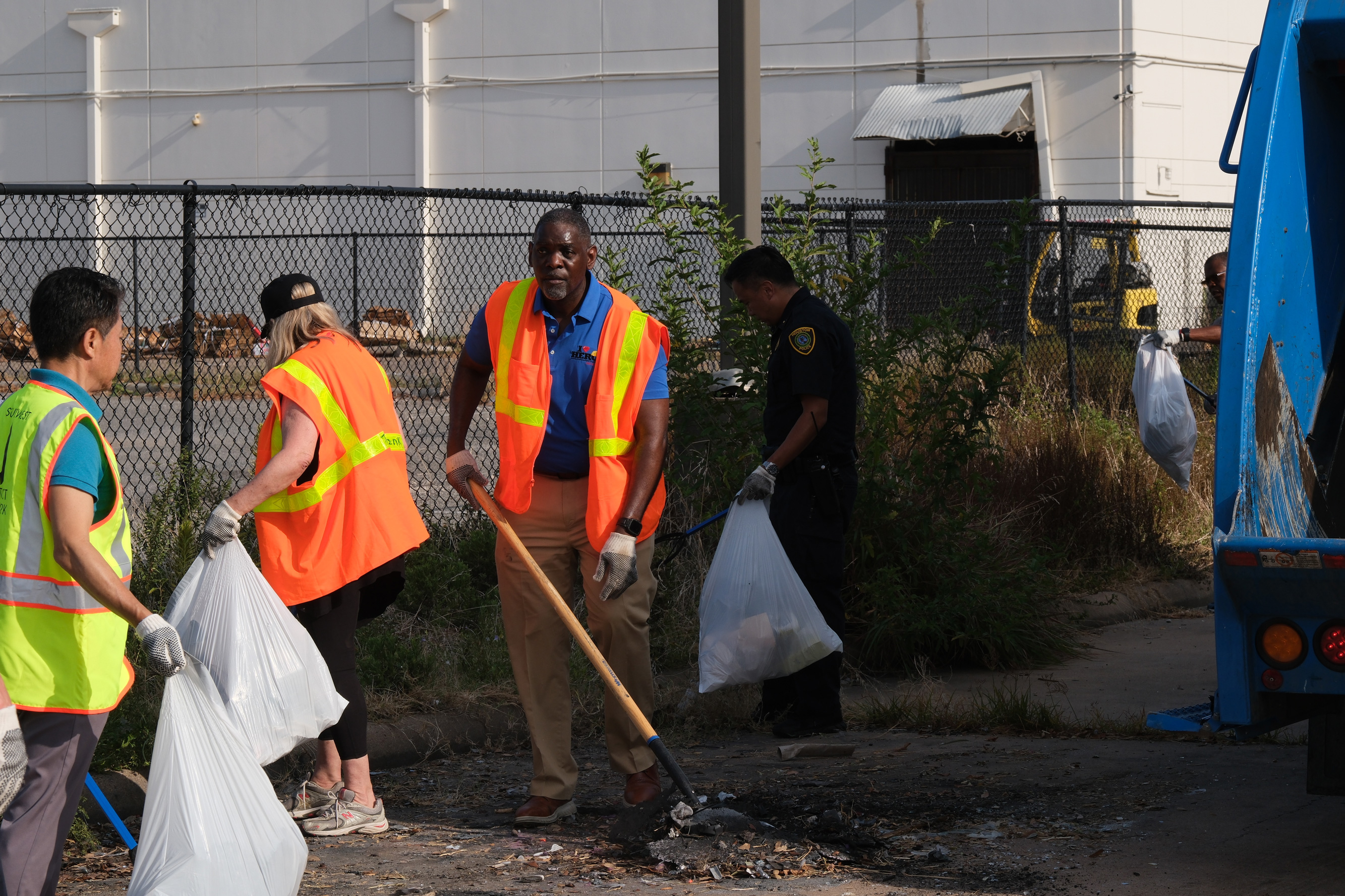 Mark Wilfaulk, director of Solid Waste Management, picks up trash during a cleanup of an area along Bissonnet known for years for its high level of prostitution and human trafficking. 