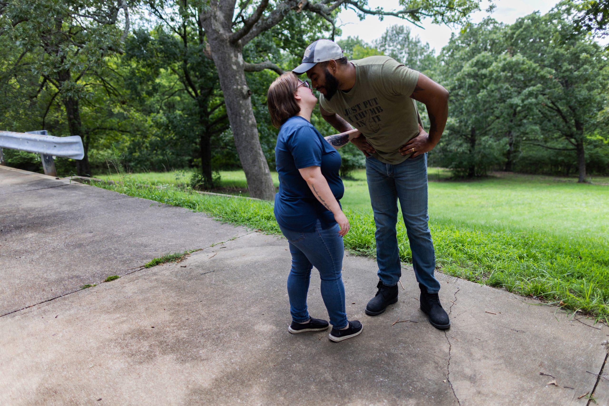Aaron Morris, right, and his wife, Cyra, share a kiss at their home in Jefferson City, Mo., in August.