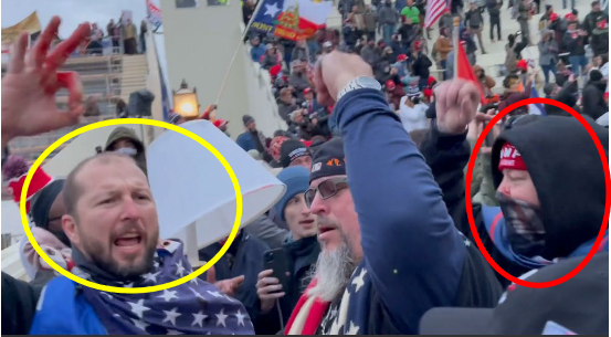A video screengrab of Adam Jackson, left, and his brother Brian, right, shows the pair at the U.S. Capitol during the Jan. 6 riot. "This video and image were likely taken after they had assaulted law enforcement
officers, given that Adam Jackson is no longer wearing his baseball hat and his raised hand appears to have blood on it," prosecutors said in a criminal complaint.