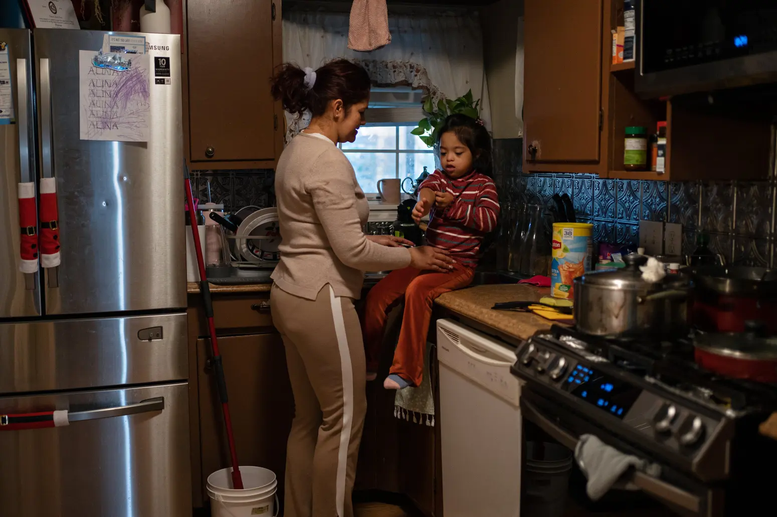 Cristina Lazo starts the daily routine of washing her daughter Alina’s hands, changing clothes and rubbing an ointment on her irritated eyes after coming home from the outside. Lazo believes the fumes from the nearby industrial sector are contributing to her 7-year-old daughter’s symptoms.