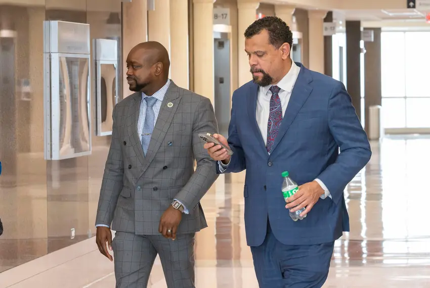 Judge DaSean Jones, left, enters the courtroom with his attorney at the Harris County Civil Courthouse in Houston on April 1, 2024