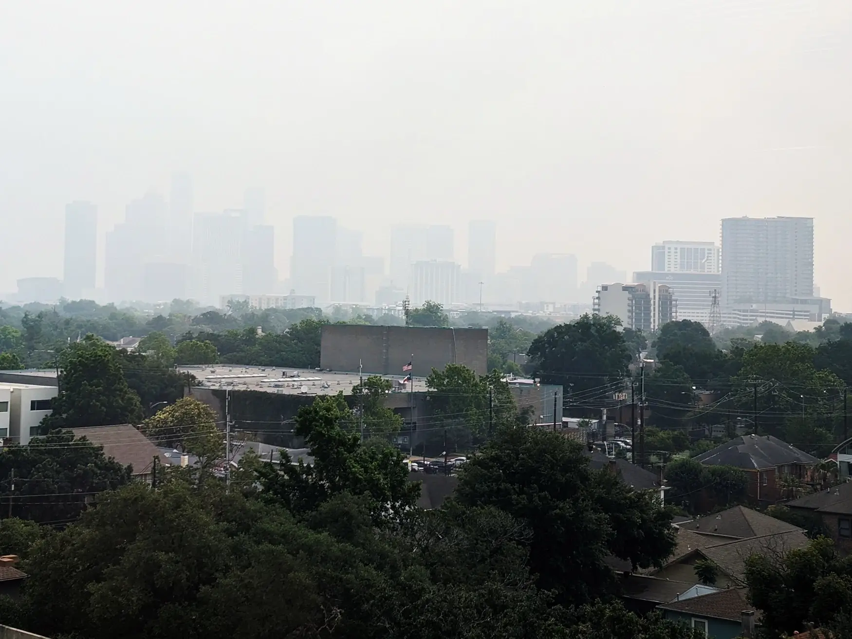 Haze from wildfires in Central and South America obscures downtown Houston